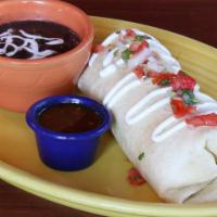 Burrito Panzon · Giant burrito stuffed with rice, lettuce, guacamole, sour cream, and pico de gallo, served w...