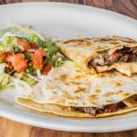 Fajita Quesadilla · One large cheese quesadilla stuffed with grilled peppers, onions, and grilled chicken, garni...