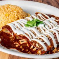 Enchiladas De Mole · Three shredded chicken enchiladas topped with cheese and our traditional mole sauce and ques...