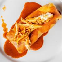One (1) Chicken Tamal · Tamale stuffed with chicken in mole verde sauce