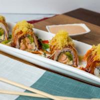 Crispy Roll · Salmon katsu, cheese, avocado topped with krab , spicy mayo, eel sauce & tempura bit.