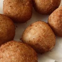 Stuffed Potatoes (Papas Rellenas) (8 Pieces) · Fried potato balls filled with ground beef.