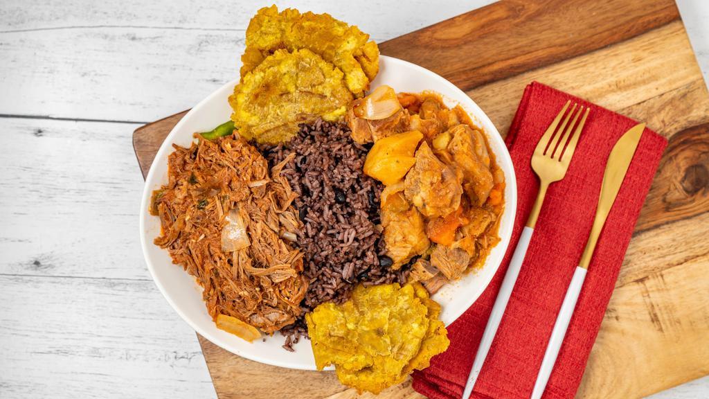 Ropa Vieja · Slow-cooked shredded beef in our house-made tomato-based sauce infused with sautéed onions & bell peppers. Served with white rice, black beans, & choice of sweet plantains, tostones, and fried yuca.