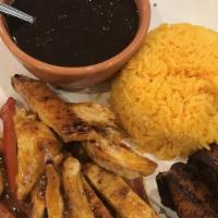 Golden Chicken (Pollo De Oro) · Grilled chicken marinated in Cuban seasonings & slow cooked in our specialty cayenne pepper ...