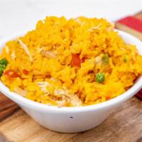 Arroz Con Pollo · Flavorful yellow rice & chicken garnished with green peas & red bell peppers.