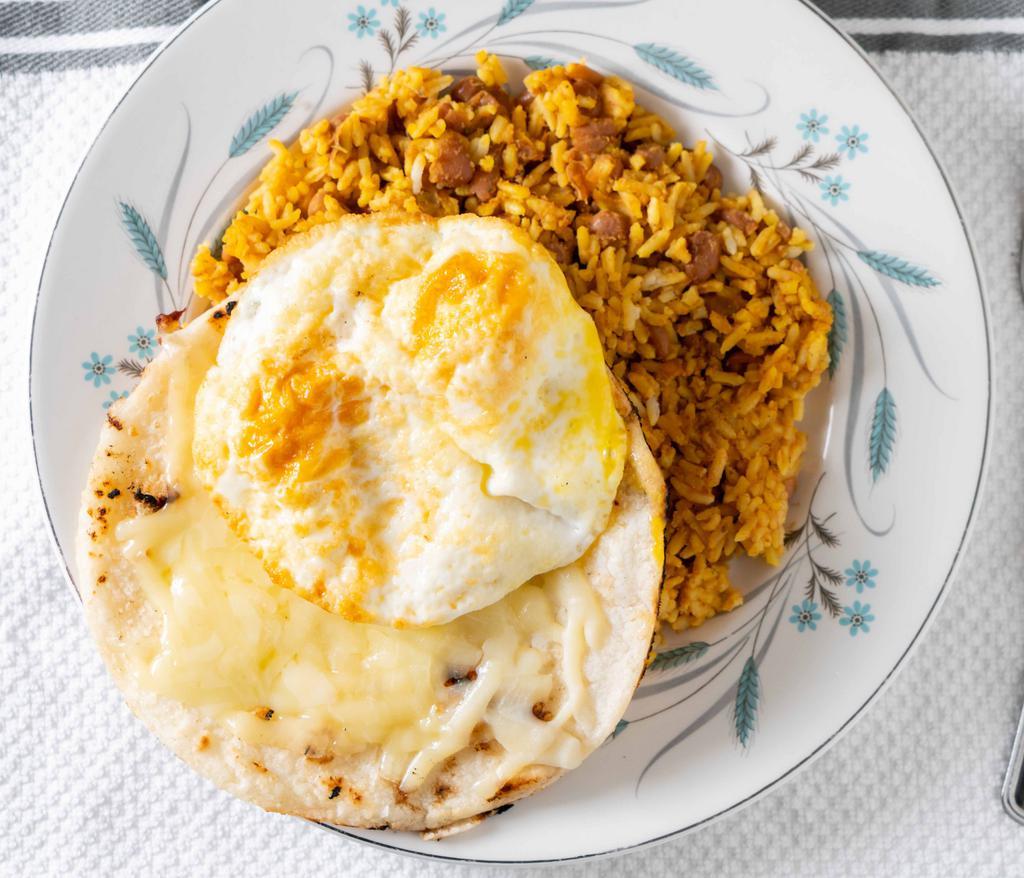Calentado Con Huevos · Mixed rice and beans served with two eggs any style and arepa with cheese.