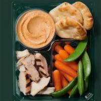 Hummus Protein Box · Roasted Red Pepper Hummus, Carrots, Cucumber. and Sunflower Seeds