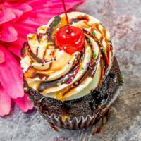 Hot Fudge Sundae · Chocolate cupcake with vanilla buttercream frosting with a chocolate and caramel drizzle, ra...