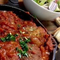Vegan Shakshuka · 5 falafels tossed in morocan tomato sauce, served in skillet, with house salad, tahini and p...