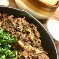 Beef Shawarma Platter · beef shawarma meat (top sirloin), 2 side on your choice, Tahini and garlic sauce on the side...