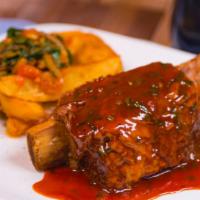 Beef Short Ribs Platter · Slow cooked beef rib(1 rib with meat on the side) in a barbecue STYLE SAUCE, 
Served with 2 ...