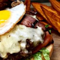 Shabo'S Burger · FRESH beef burger, fried egg, turkey bacon and fried mozzarella cheese, mixed greens and tom...