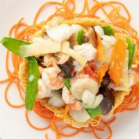 Seafood In Bird'S Nest · Combination of lobster meat, scallop, shrimp, fish fillet stir fried with assorted vegetable...