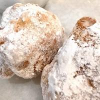 Zeppoli · Fried dough tossed in powdered sugar