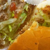 Philly Cheese Steak · Sliced Ribeye Steak, grilled onions, melted white american cheese, mayo, lettuce & tomato
 a...