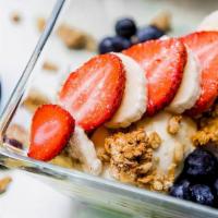 Greek Yogurt · Strawberry, banana, blueberries, and granola.