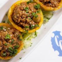Tostones Rellenos De Carne · Crispy Fried Green Plantain Cups Filled with Ground Beef 