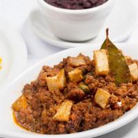 Picadillo · Ground Beef Cooked with Onions, Peppers, Olives, Raisins and Tomato Sauce