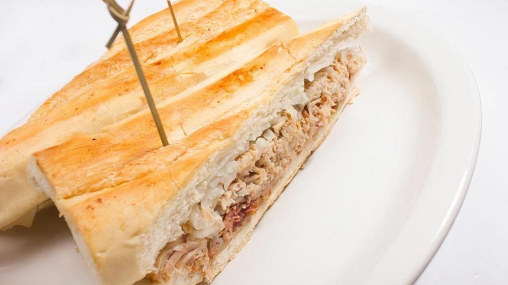 Pan Con Lechon · Roast Pork Sandwich on Cuban Bread with Onions and Mojo