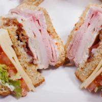 Club Sandwich · Ham, Turkey, Bacon, Swiss Cheese, Lettuce, Tomatoes and Mayonnaise