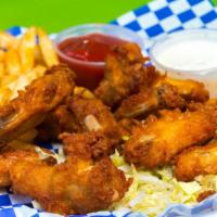 Chicken Wings · Mexican style chicken wings served over lettuce.