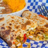 Chicken Quesadilla · Quesadilla made with slices of melted Mexican cheese, lettuce, pico de gallo, guacamole, and...