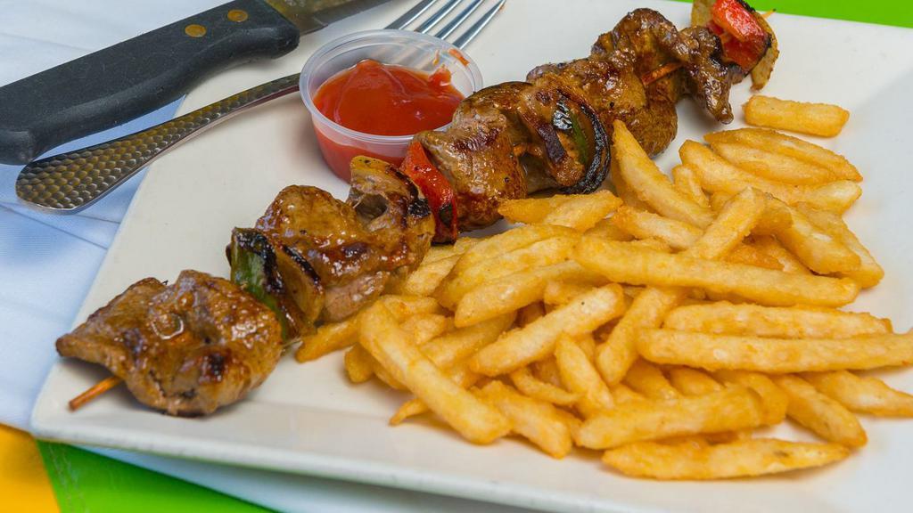 Steak Skewers W/French Fries · Grilled steak served with onions and mixed peppers. French fries are included.