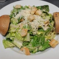 Caesar Salad · Classic romaine lettuce salad garnished with Parmesan Cheese, and homemade croutons tossed w...
