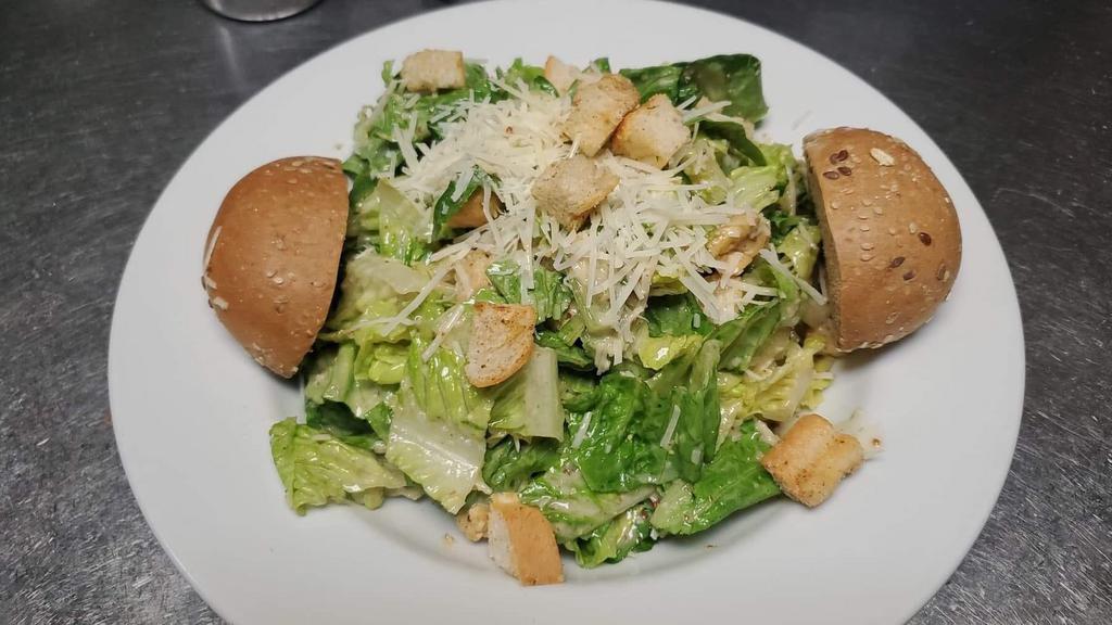 Caesar Salad · Classic romaine lettuce salad garnished with Parmesan Cheese, and homemade croutons tossed with eggless Caesar dressing. Add chicken for an additional charge.