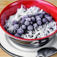 Bali Vegan Bowl · Blueberry, spirulina, banana, coconut milk mix, blueberry topping, and coconut flakes.