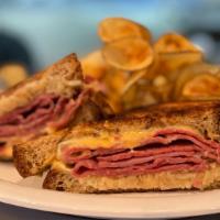 Reuben · Lean corned beef, sauerkraut, and melted Swiss cheese with thousand island dressing and serv...