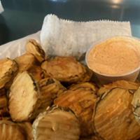 Deep Fried Pickles · Dill breaded pickle in seasoned flour and fried to perfection.  Served with cajun ranch