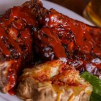 Half Rack Of Ribs · Baby Back Ribs served with one side and garlic bread