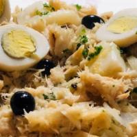 Bacalhau A Gomes De Sa · Shredded codfish, boiled egg and potatoes.