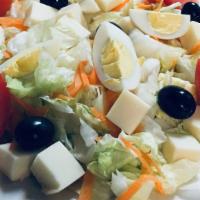 Salada Portuguesa With Chicken · Lettuce, tomato, onions, olives, carrots, cheese, and boiled egg.