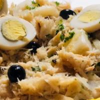Bacalhau A Gomes De Sa · Shredded codfish mixed with steamed potatoes, boiled egg, garlic and onions.