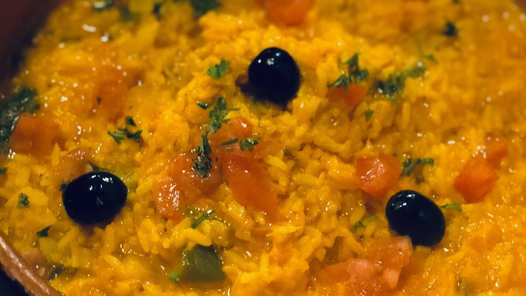 Arroz De Bacalhau · Codfish stew with rice.