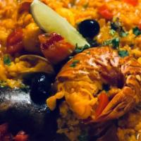 Paelha A Marinheira For 1 Person · Seafood saffron rice: lobster tail, clams, shrimp , mussels and squid .