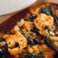 Feijoada De Mariscos  · Seafood stew: clams, mussels, shrimps , squid, in white beans and rice.
