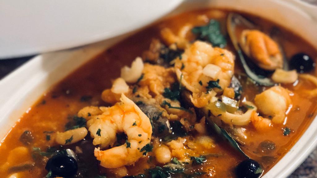 Feijoada De Mariscos  · Seafood stew: clams, mussels, shrimps , squid, in white beans and rice.
