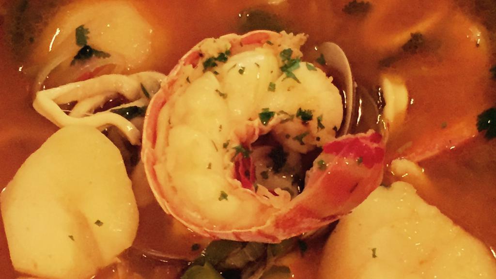 Cataplana De Mariscos Algarve · Algarve seafood stew: Fish, clams, shrimps, mussels, squid, lobster tail and in tomato sauce.