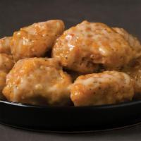 Garlic Parm Boneless (15Pc) · Tender all-white meat breaded chicken oven-baked and covered in a creamy roasted garlic parm...