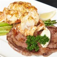 12 Oz Ribeye & Lobster · Served over garlic mashed potato and asparagus.
