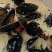 Mussels Marinière · shallots, white wine cream sauce.