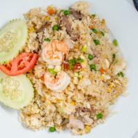 Dragon Fried Rice · Stir fried pork, beef, shrimp, and chicken, onion, peas, carrots, and scallions.