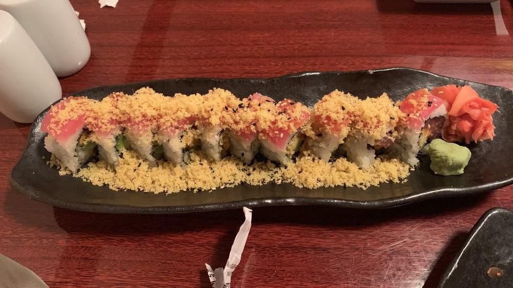 Hot Girls Roll · Spicy tuna tartar, flake, avocado inside topped with tuna sushi and tempura flake.