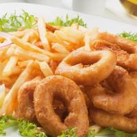 Fried Calamari With French Fries · Lightly dusted calamari rings & tentacles with fries.