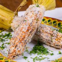 Mexican Street Corn · Fresh grilled corn topped with mayo, queso fresco and Mexican spices.