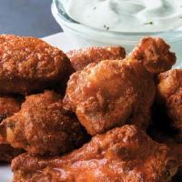 Chicken Wings (10 Pieces) · 100 calories per piece. Order of 10 big and meaty chicken wings served classic buffalo style...