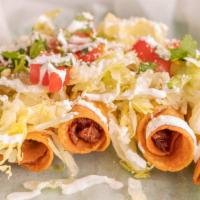 Flautas · Five deep fried rolled tortillas filled with chicken or barbacoa topped with lettuce, tomato...